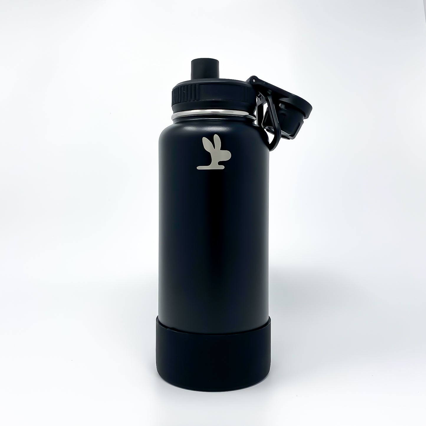 Black gym bottle with an opened chug spout on a white background